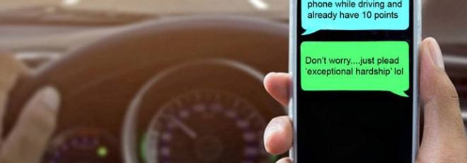 driver texting at wheel